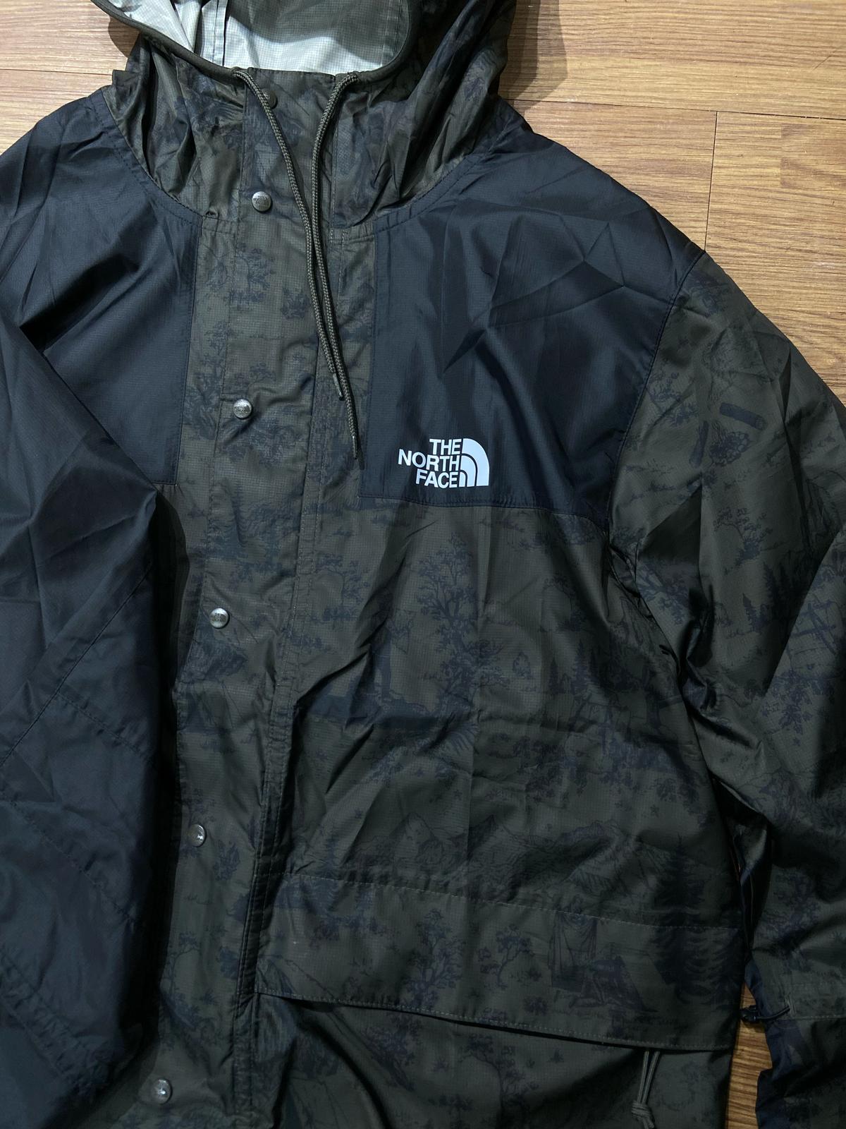 The North Face TNF 1985s Seasonal Mountain Lightweight Waterproof Jacket Black Woodland Green Camo